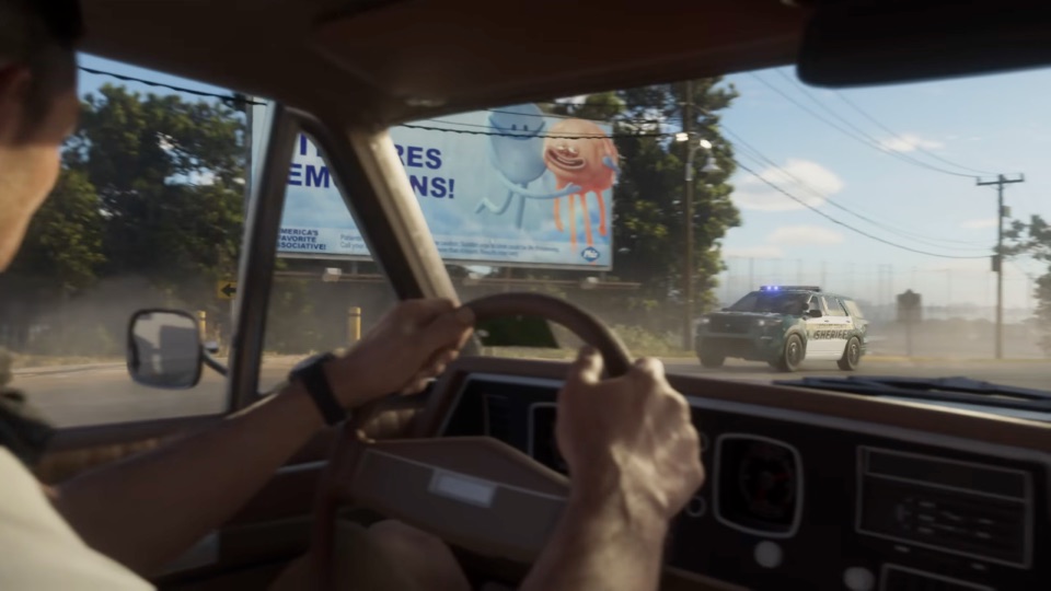 A Leonard County Sheriff SUV speeding past, seen through a car windshield