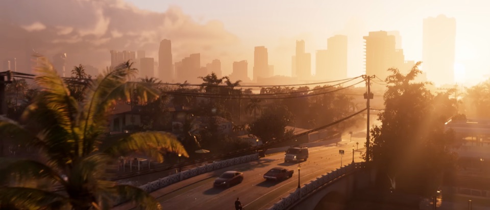 Traffic crossing a causeway at golden hour with the Vice City skyline in the distance